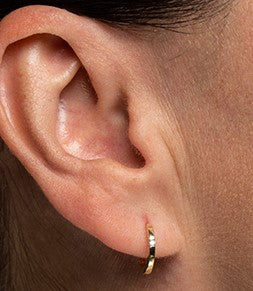 Diamond 0.04 ct. T.W. 10k yellow huggies earrings
